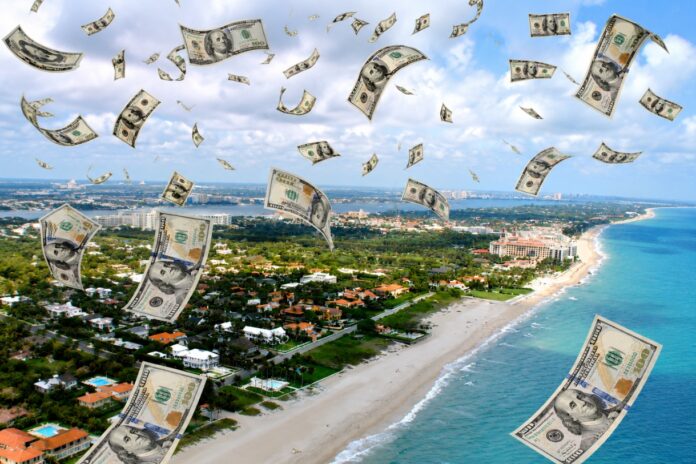 Aerial view of a Florida coastline with $100 bills falling from the sky to symbolize rising living costs and inflation in Florida.