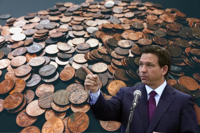 Pile of U.S. pennies stacked and scattered in close-up macro view representing the end of the penny in Florida