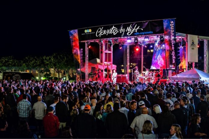 Crowds gather at Clematis by Night in downtown West Palm Beach during a live waterfront concert.