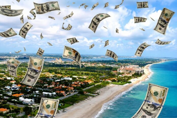 Aerial view of Palm Beach with dollar bills falling from the sky, symbolizing rising costs and affordability challenges in Florida.