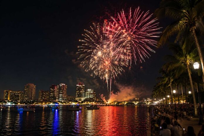 Fireworks explode above the Intracoastal Waterway during West Palm Beach's One Epic Fourth on Flagler celebration as thousands gather along Flagler Drive to celebrate Independence Day.