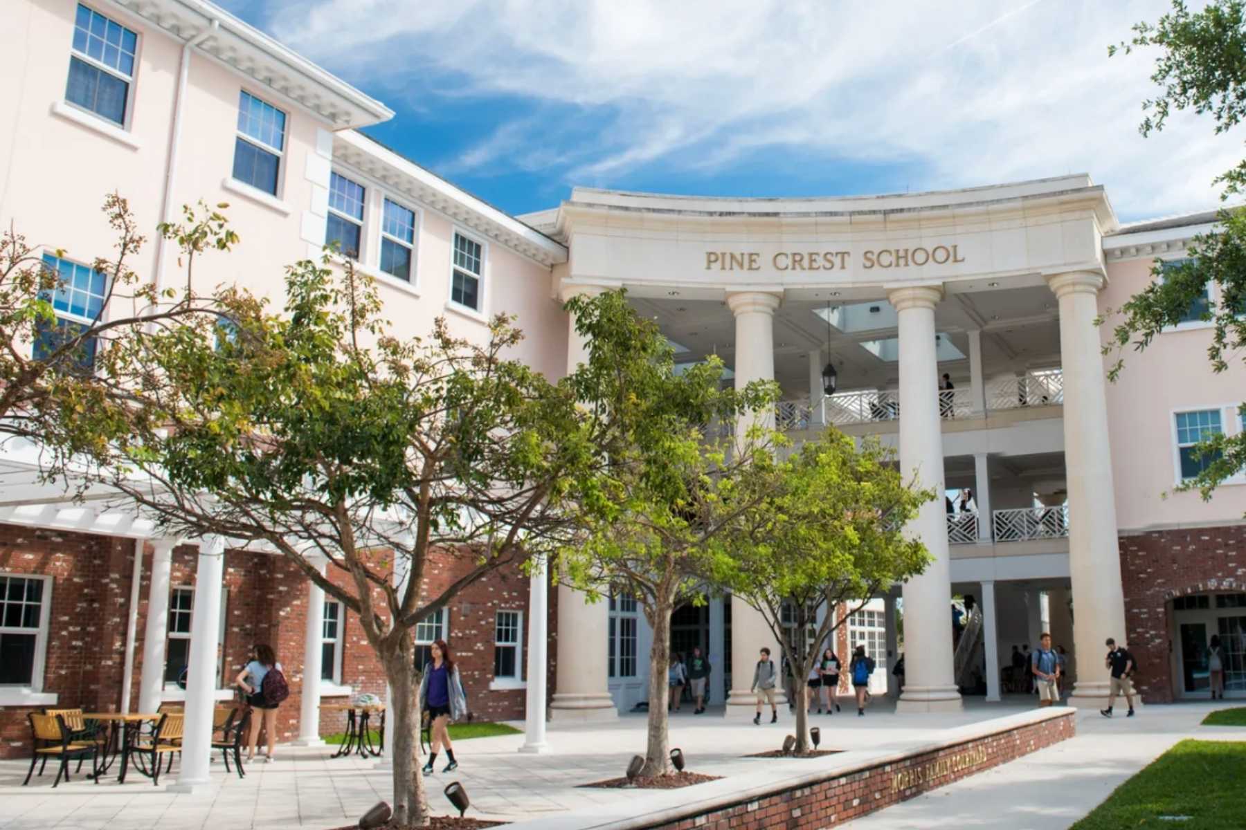 Pine Crest School campus building with students outside.
